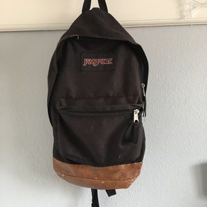Black Jansport Backpack With Leather Bottom